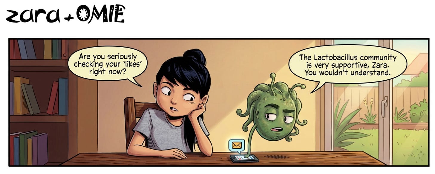 Zara skeptically watches Omie, a floating microbe, as he checks a tiny smartphone. Zara asks if he's checking his "likes," and Omie replies that the "Lactobacillus community is very supportive."