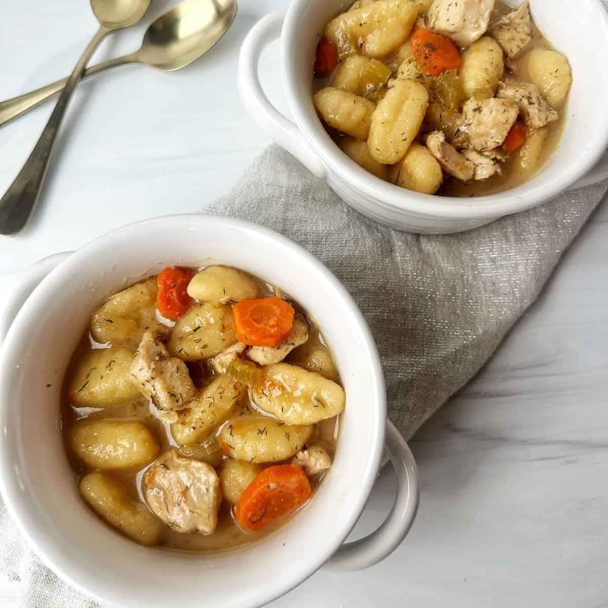 Roasted Brussels sprouts, chopped apples, pecans, sweet potatoes, and bacon in a white bowl.