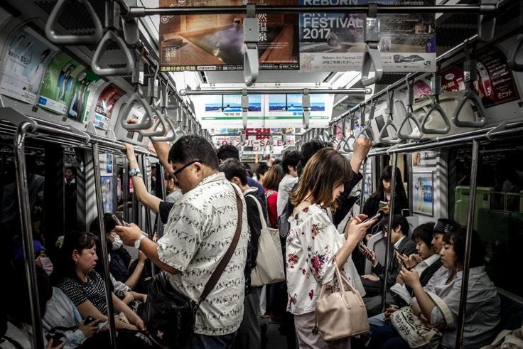 This may contain: many people are riding on the subway train This may contain: many people are riding on the subway train