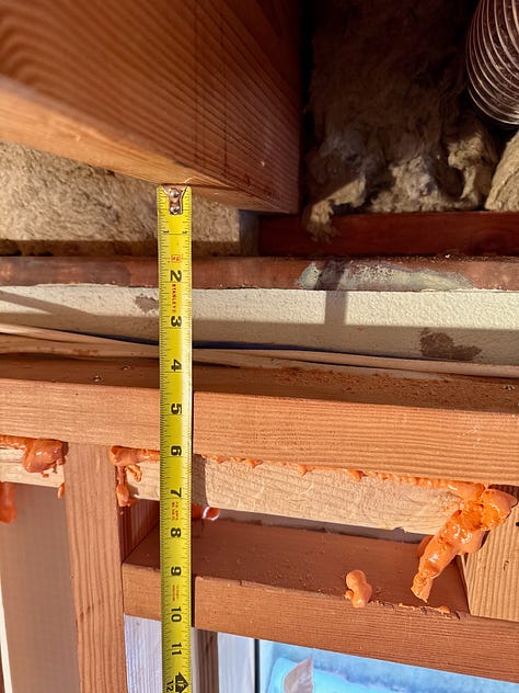Pictures showing an open wall where drywall would be attached.