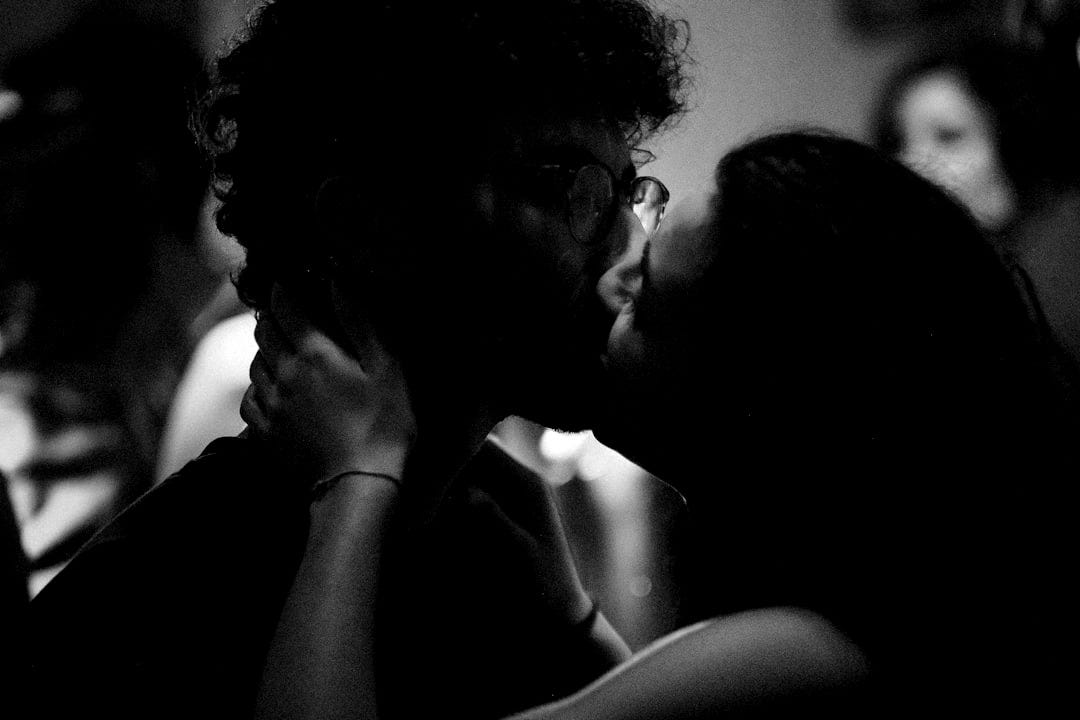 a couple of people that are kissing each other