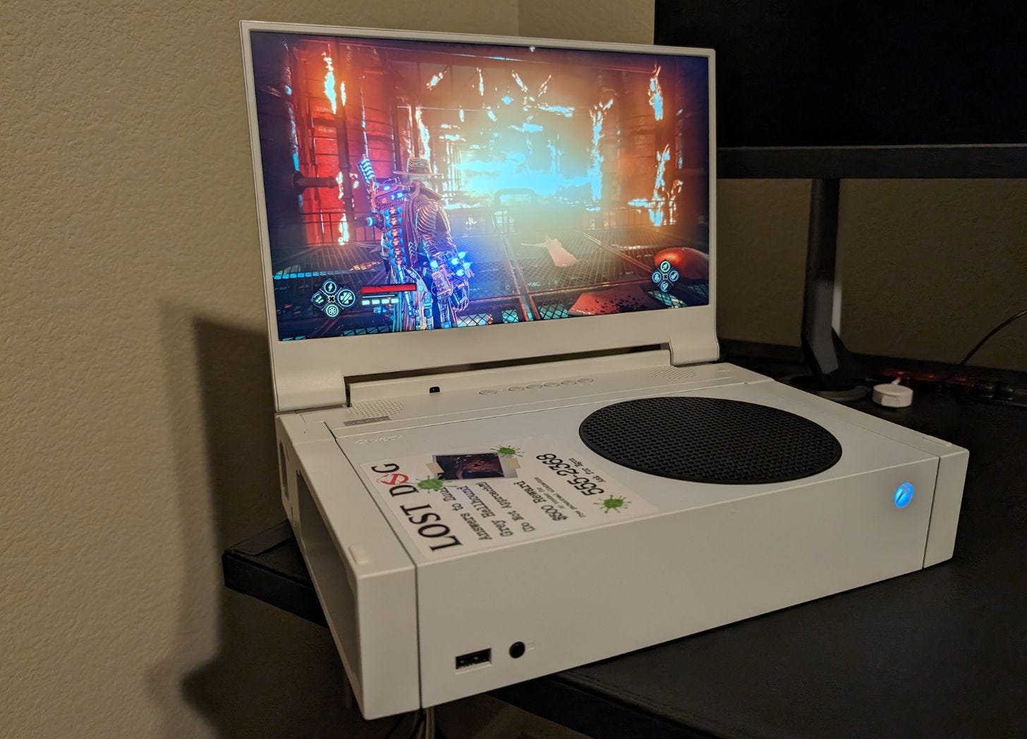 Evil West played on a 14-inch portable monitor.