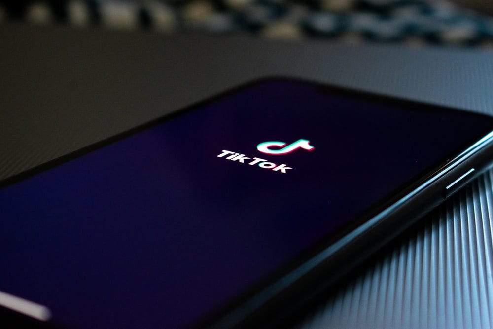 black smartphone displaying Tik Tok logo black smartphone displaying Tik Tok logo