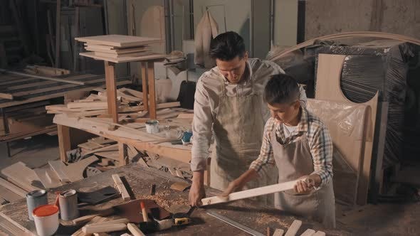 Boy Learning Carpentry With Father, Stock Footage | VideoHive