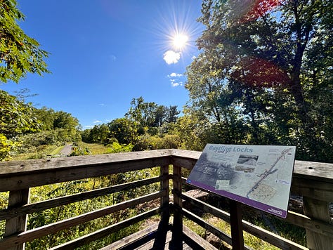 Blue heron statue, pumpkins on wagon, MD Garage at night, trail leading toward tunnel, mural in Canal Fulton, deck overlooking wetland