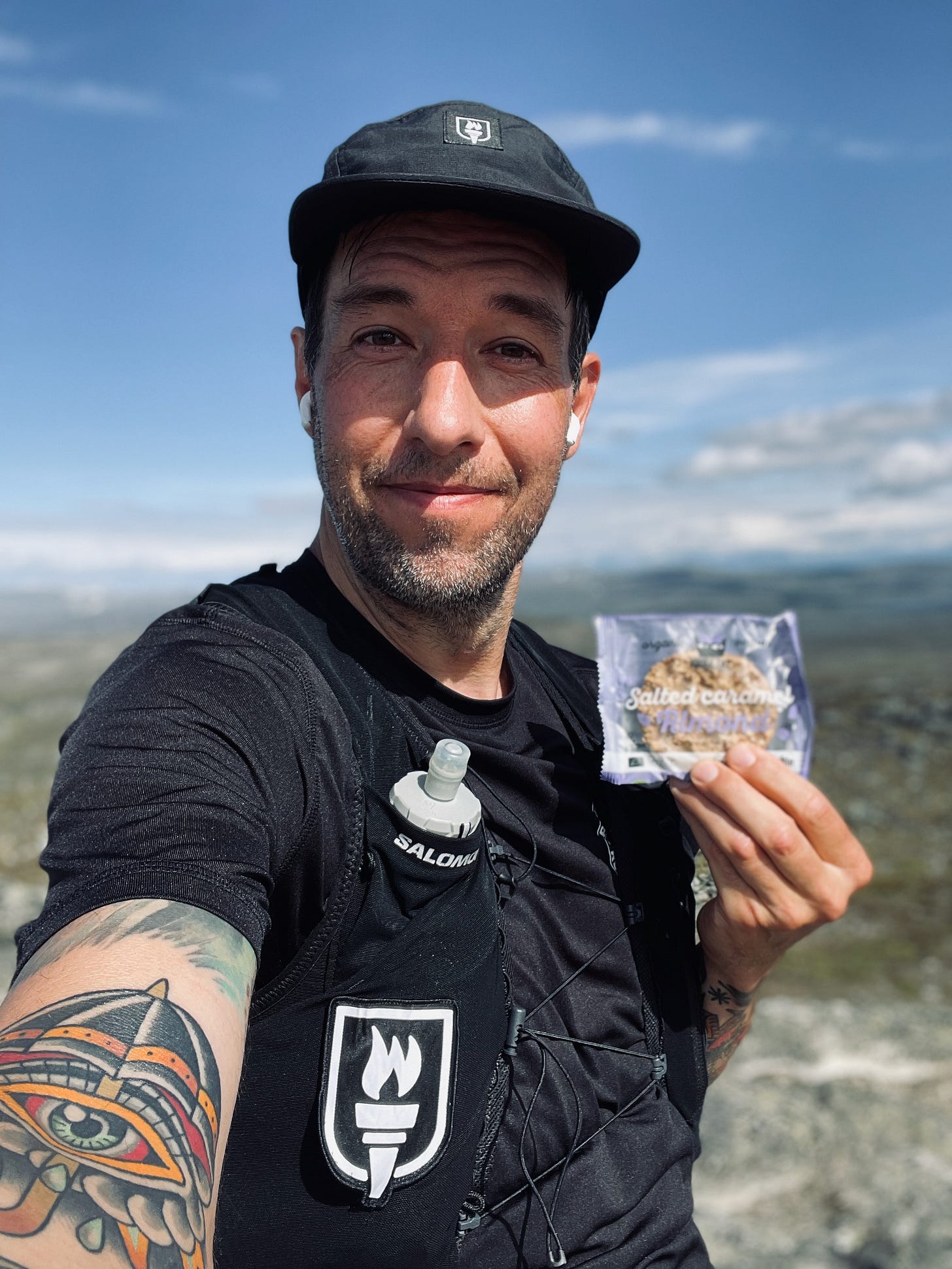 The author Chris posing with a salted caramel cookie