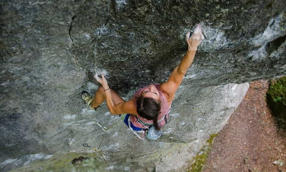 woman climbing a rock wall in germany