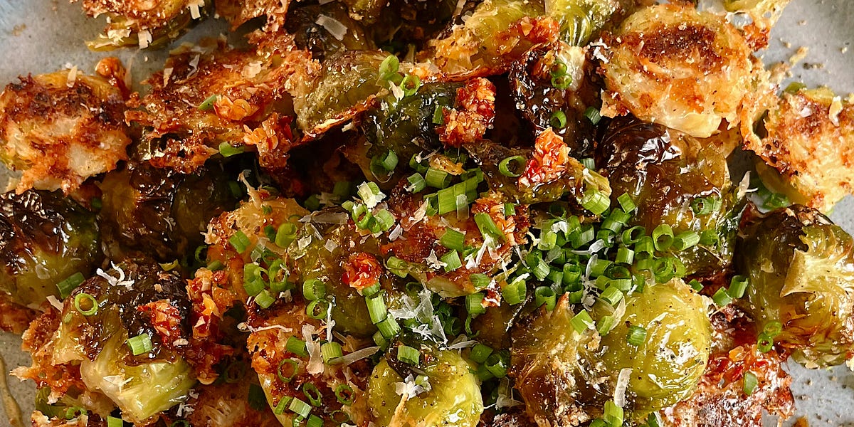 crispy parmesan brussels with hot honey 🍯 - by Emma Kula