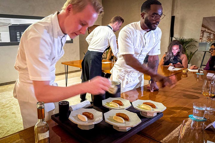 Torsten Vildgaard is the second chef on the right plating the duck in the first photo. The second photo features other FZN chefs plating the tart tatin.