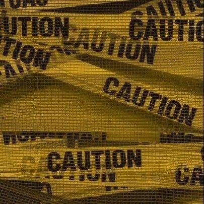 This may contain: there are many caution signs on the mesh fabric that is covering the area in yellow and black