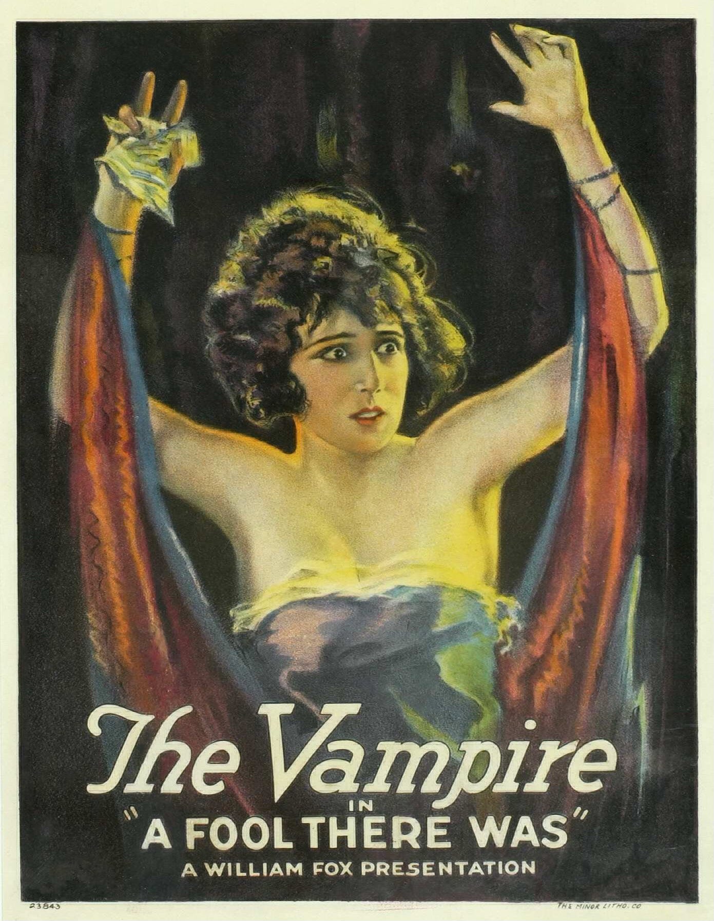 Color promotional film poster features an illustration of Theda Bara wearing a gauzy outfit. CAPTION READS: “The Vampire” in “A Fool There Was” A William Fox Presentation Color promotional film poster features an illustration of Theda Bara wearing a gauzy outfit. CAPTION READS: “The Vampire” in “A Fool There Was” A William Fox Presentation
