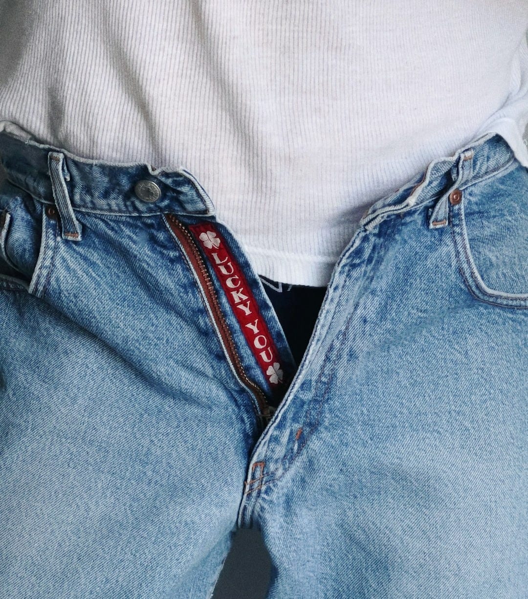 a person's jeans with a red label on it