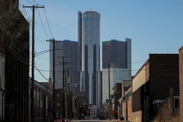 Glass-covered towers against a blue sky. Glass-covered towers against a blue sky.