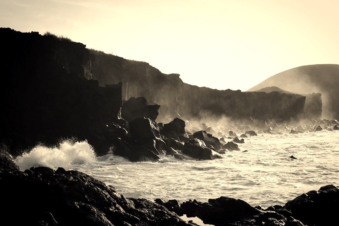 body of water surrounded rocks body of water surrounded rocks