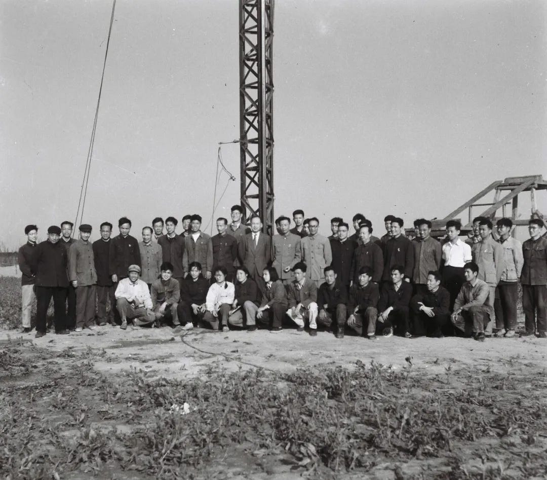 Wang Xiji (standing to the right of the launch rail) with members of his sounding rocket team and Qian Xuesan (next person to the left), another space legend, after launching T-7M. Wang Xiji (standing to the right of the launch rail) with members of his sounding rocket team and Qian Xuesan (next person to the left), another space legend, after launching T-7M.