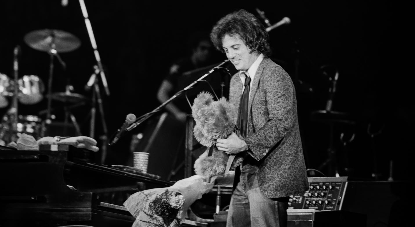 A person holding a stuffed animal

AI-generated content may be incorrect.