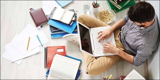 Student-writing a paper Student-writing a paper