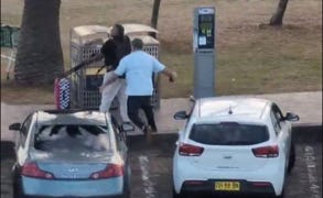 A person pushing a cart next to a white car

AI-generated content may be incorrect.