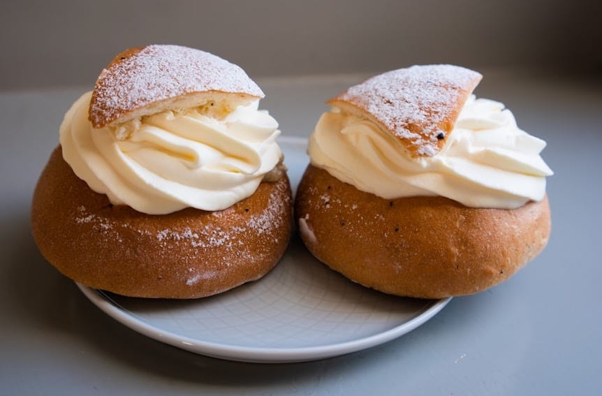 two brown bread on white ceramic plate two brown bread on white ceramic plate