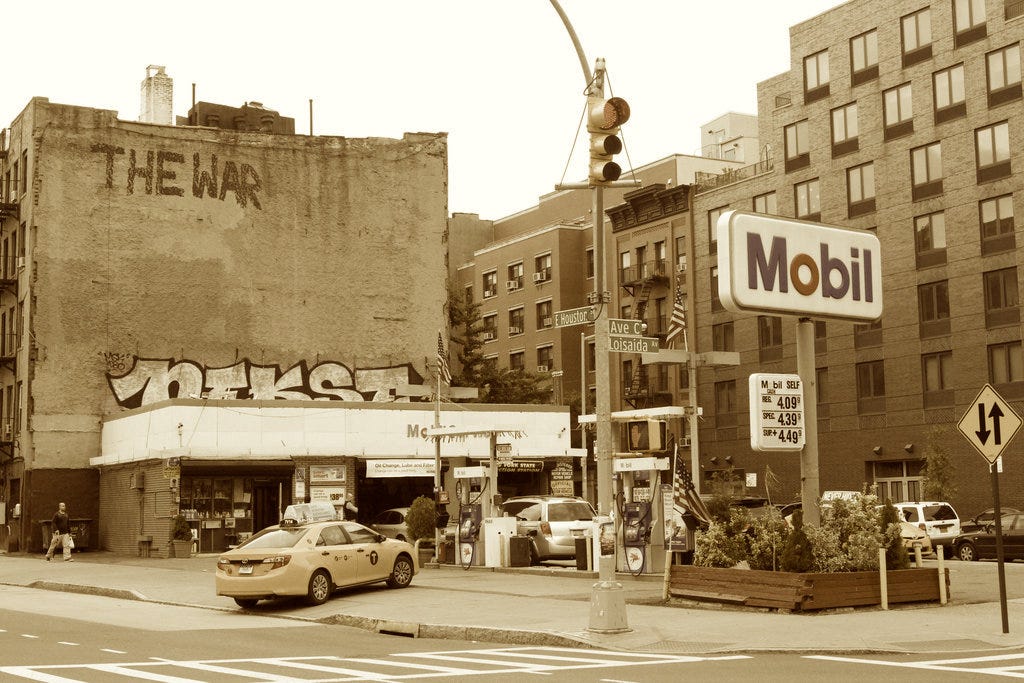 A picture containing text, outdoor, building, sky

Description automatically generated