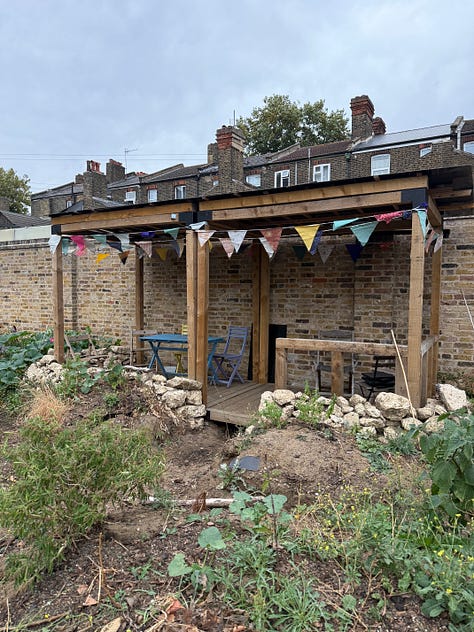 Images of the Leyton Boundary garden sign and pavilion decked in bunting, and the visiting crowds at the community garden.
