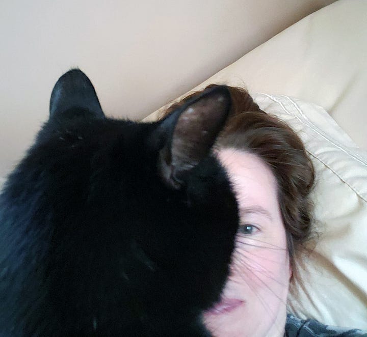 A black cat cuddles a woman on a couch (left) and snuggles her in bed (right).