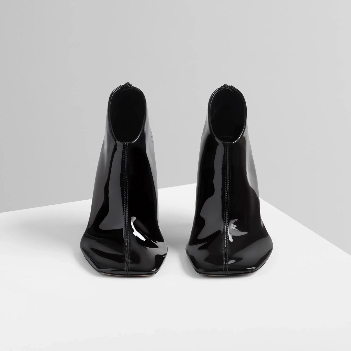 Front view of Soft Ankle Boot 90 in glossy black.