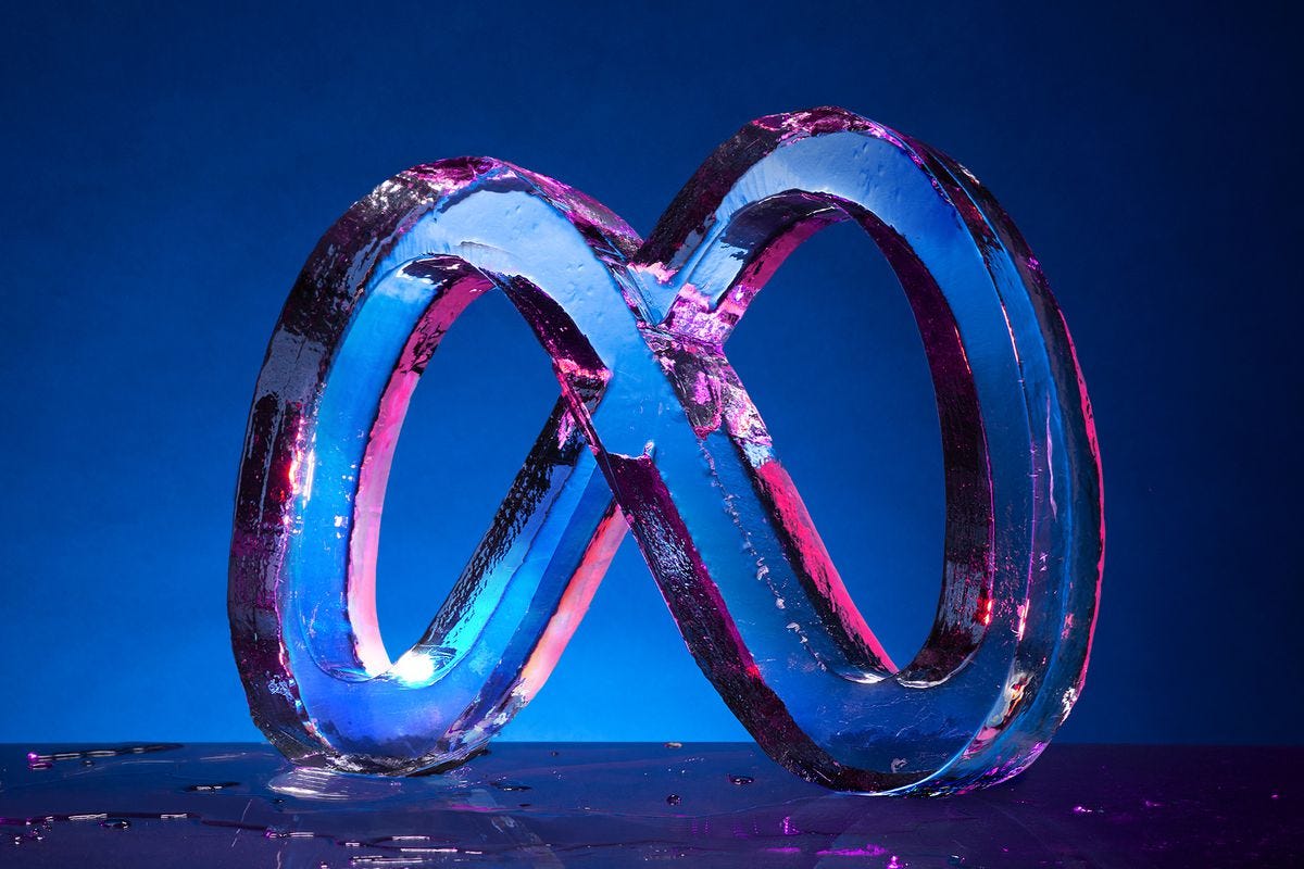 Ice Sculpture of the Meta logo on a moody blue background.