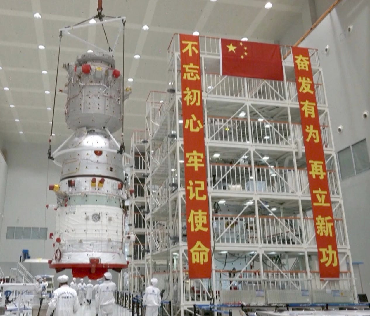 A Shenzhou spacecraft, for the Shenzhou-14 mission in 2022, undergoing pre-launch processing before being integrated with its launch escape system. A Shenzhou spacecraft, for the Shenzhou-14 mission in 2022, undergoing pre-launch processing before being integrated with its launch escape system.