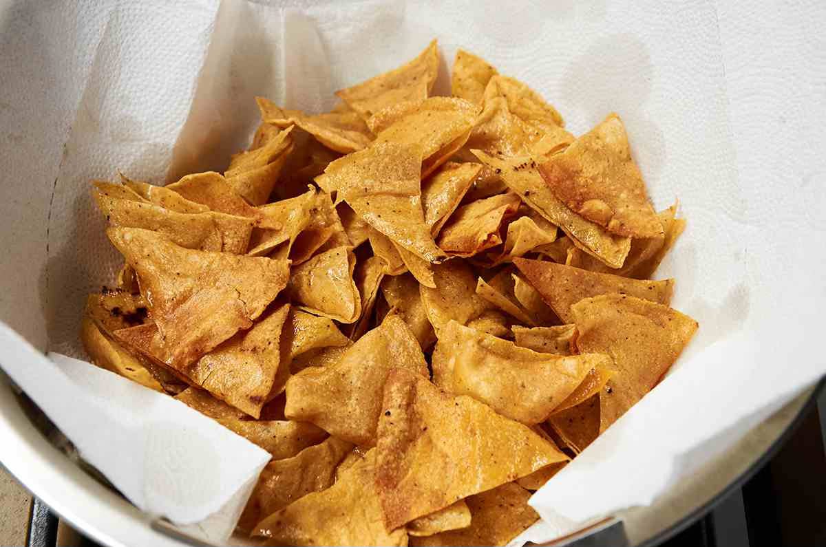 homemade tortilla chips draining in bowl