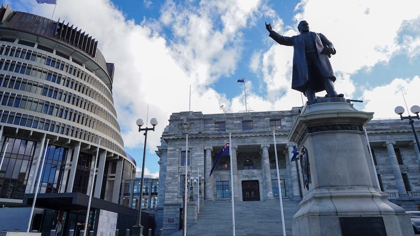 An image of sandstone buildings against a blue sky An image of sandstone buildings against a blue sky
