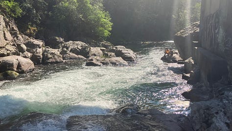 Photos of river rapids along the rocks, clouds over the forest and ocean inlet, roses and trees, man wearing glasses in San Francisco, man wearing bike helmet and sunglasses on Angel Island