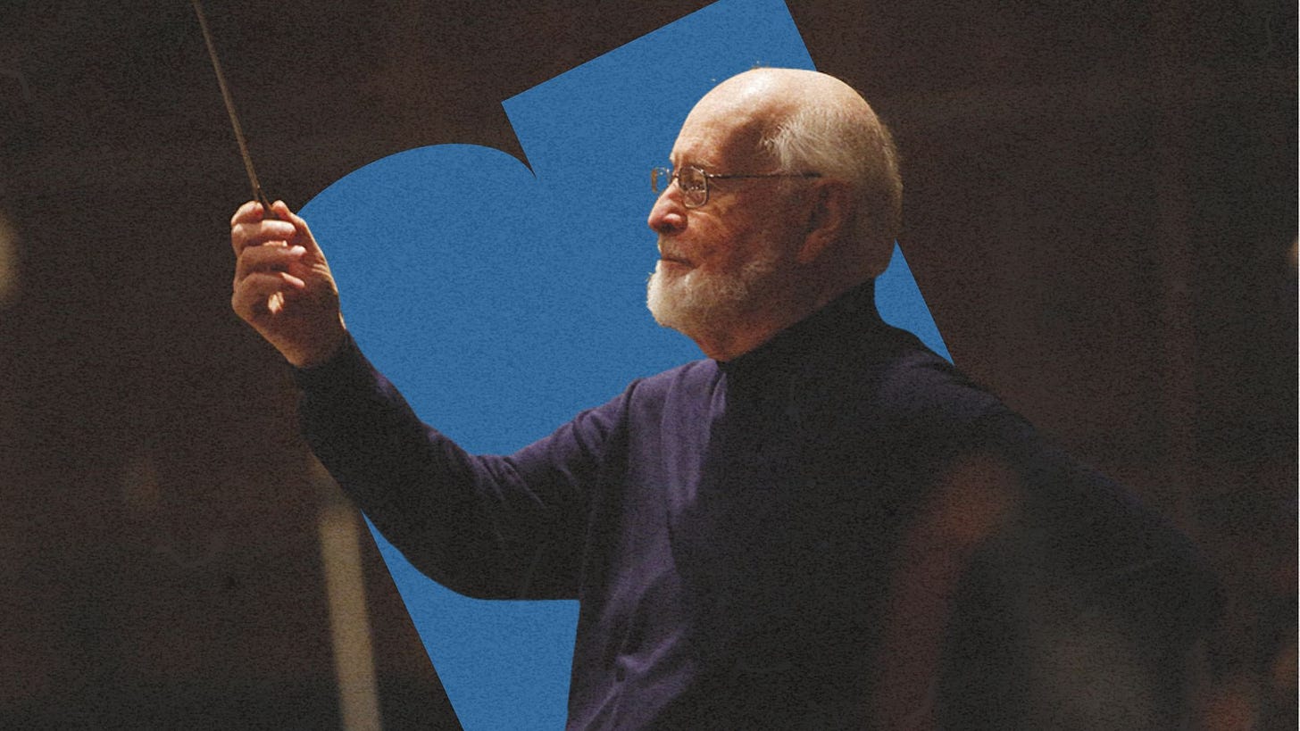 Legendary composer John Williams conducting an orchestra Legendary composer John Williams conducting an orchestra