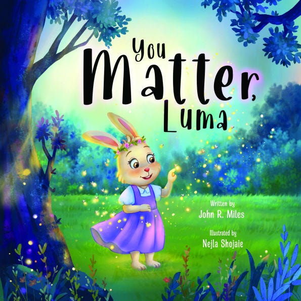 Cover of the children’s book You Matter, Luma, showing a cheerful young bunny named Luma standing barefoot in a glowing forest meadow. She wears a purple dress and a flower crown, surrounded by sparkles of light as she reaches out with wonder. The title appears above her, with credits to author John R. Miles and illustrator Nejla Shojaie.