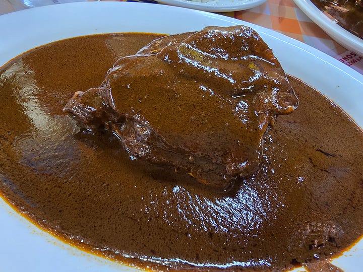 Watermelon agua fresca, cream soup, rice with egg, mole with chicken