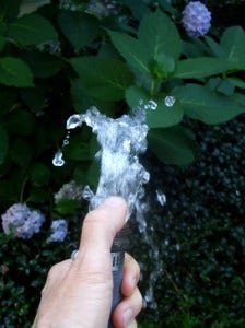 thumb on hose