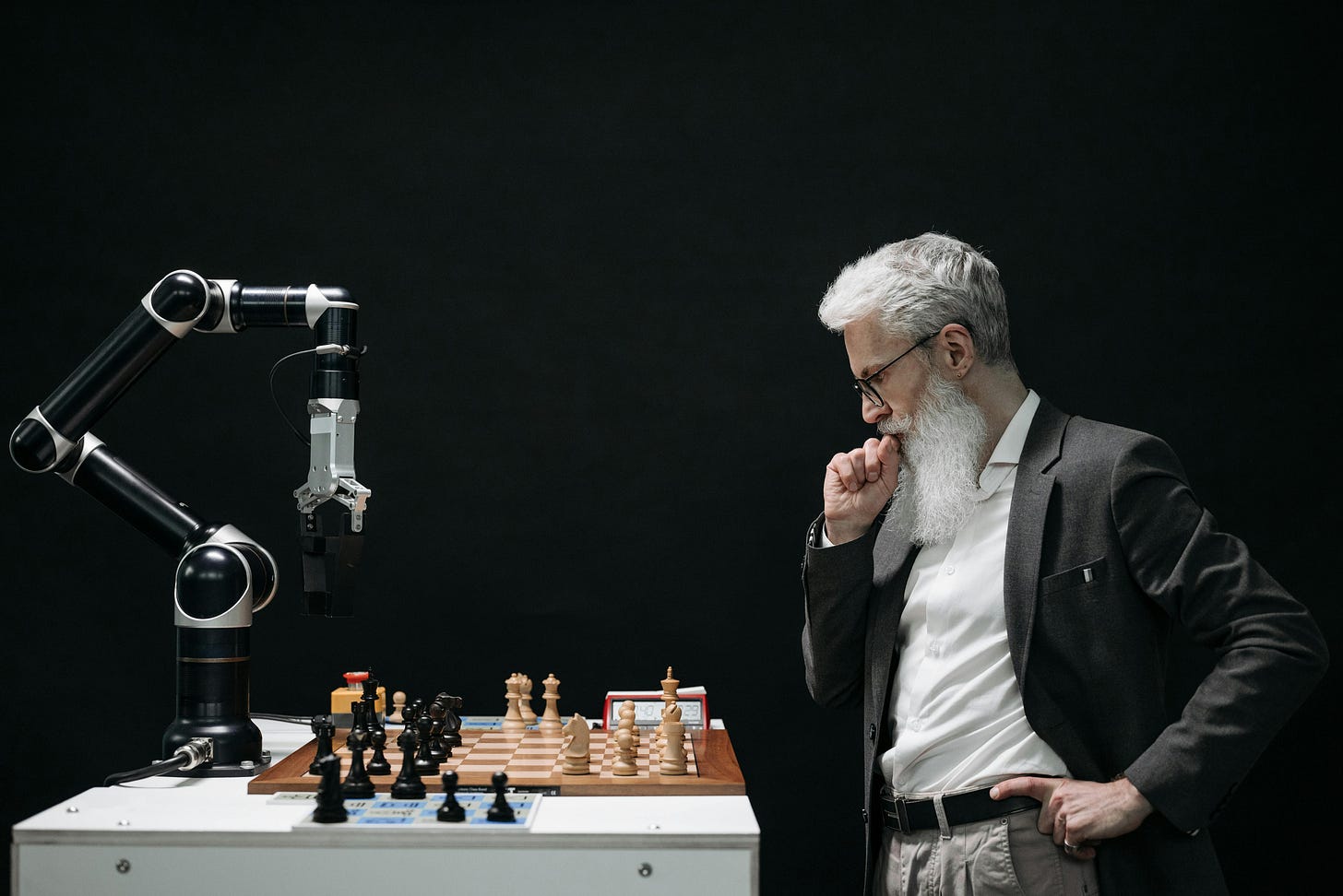 Man thinking while looking at a chessboard