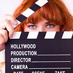 Female director with clapperboard Female director with clapperboard