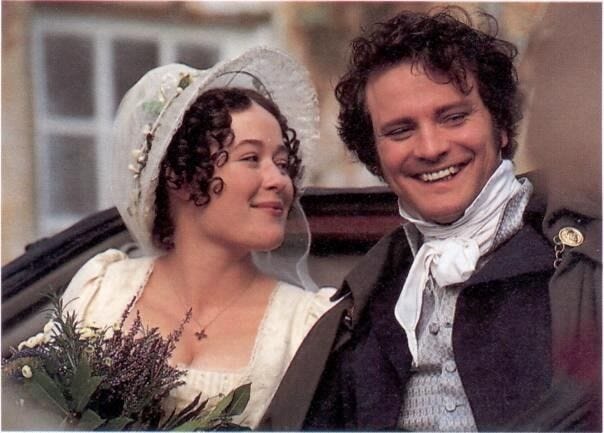 This may contain: there is a man and woman that are dressed up in period clothing, standing next to each other