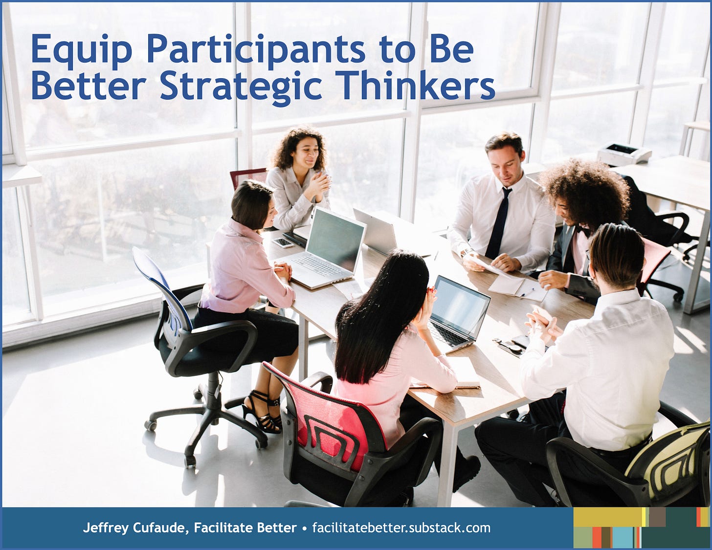 six younger professionals in business attire meet at a conference table covered with papers and laptops