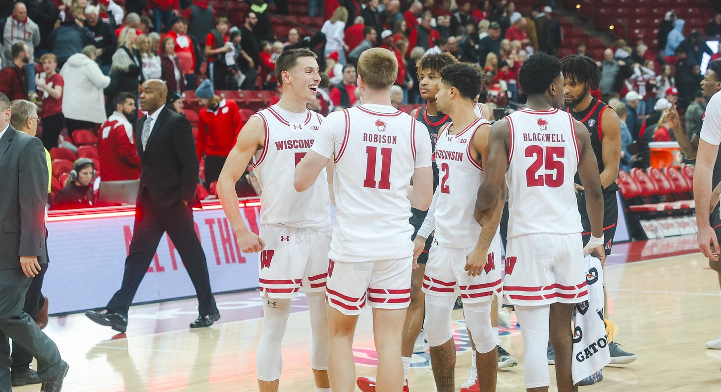 Jack Robison celebrating with Wisconsin teammates after a game at the Kohl Center. Jack Robison celebrating with Wisconsin teammates after a game at the Kohl Center.