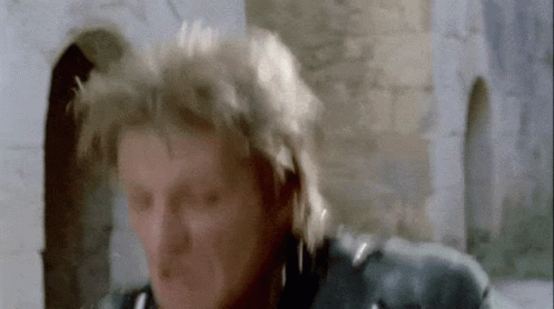 a close up of a man 's face with a blurred background