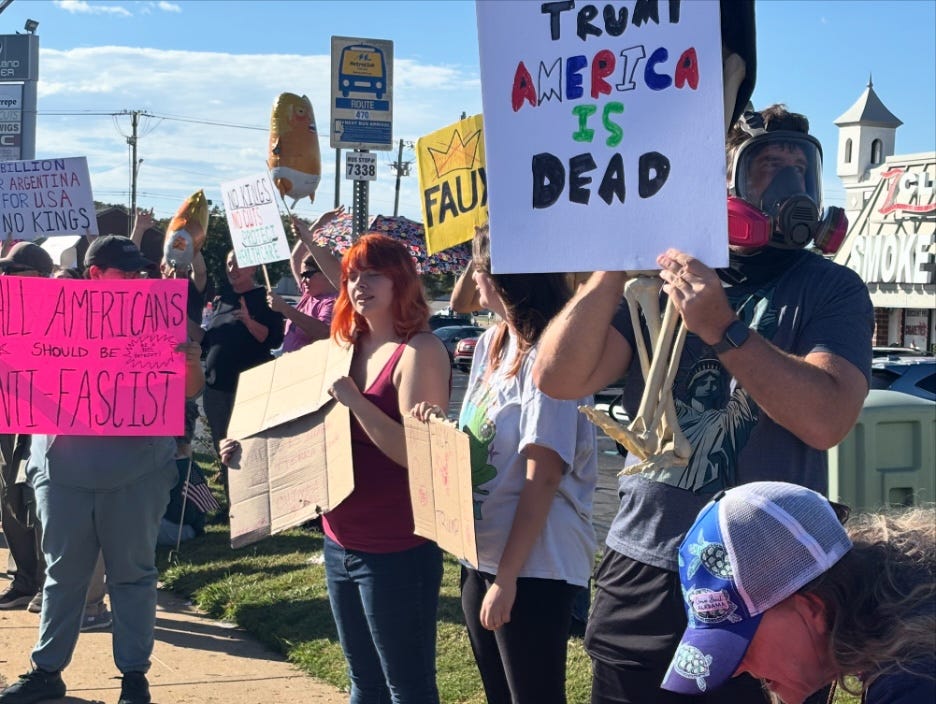 A group of people holding signs

AI-generated content may be incorrect.