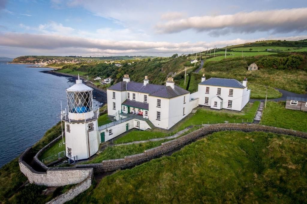 Historic Irish lighthouse overlooking the Atlantic coastline.