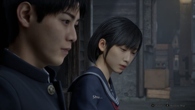 Two Japanese students sit in a foggy town
