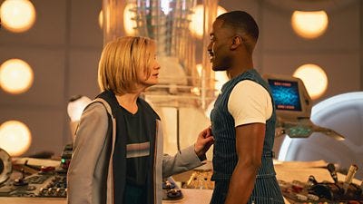 The Thirteenth Doctor (Jodie Whittaker) and Fifteenth Doctor (Ncuti Gatwa) stand face to face at the TARDIS console