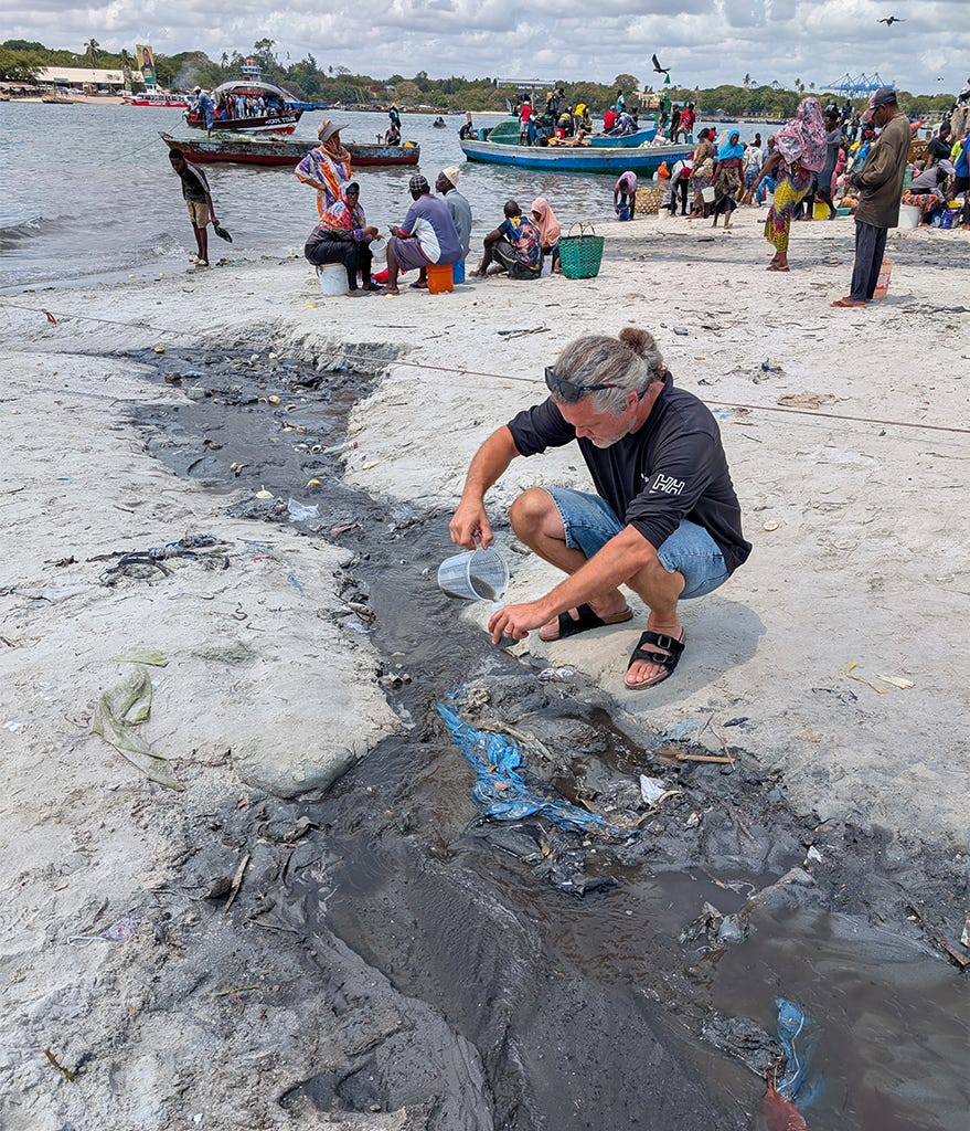 A researcher collects environmental samples as part of a pathogen surveillance program in Tanzania. In many low- and middle-income countries, sanitation and wastewater treatment facilities are less available, and drug-resistant infections are prevalent. Image courtesy of Tam T. Tran.