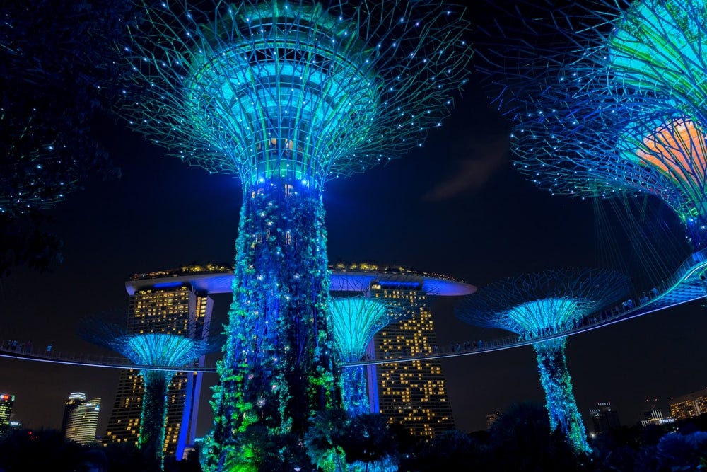 blue lighted towers during nighttime blue lighted towers during nighttime