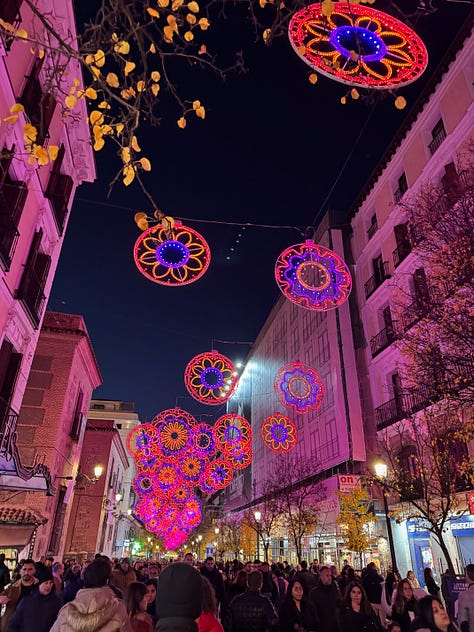 Scenes from Madrid at Christmas, including lights, markets, churros, decorations, and city streets at night.