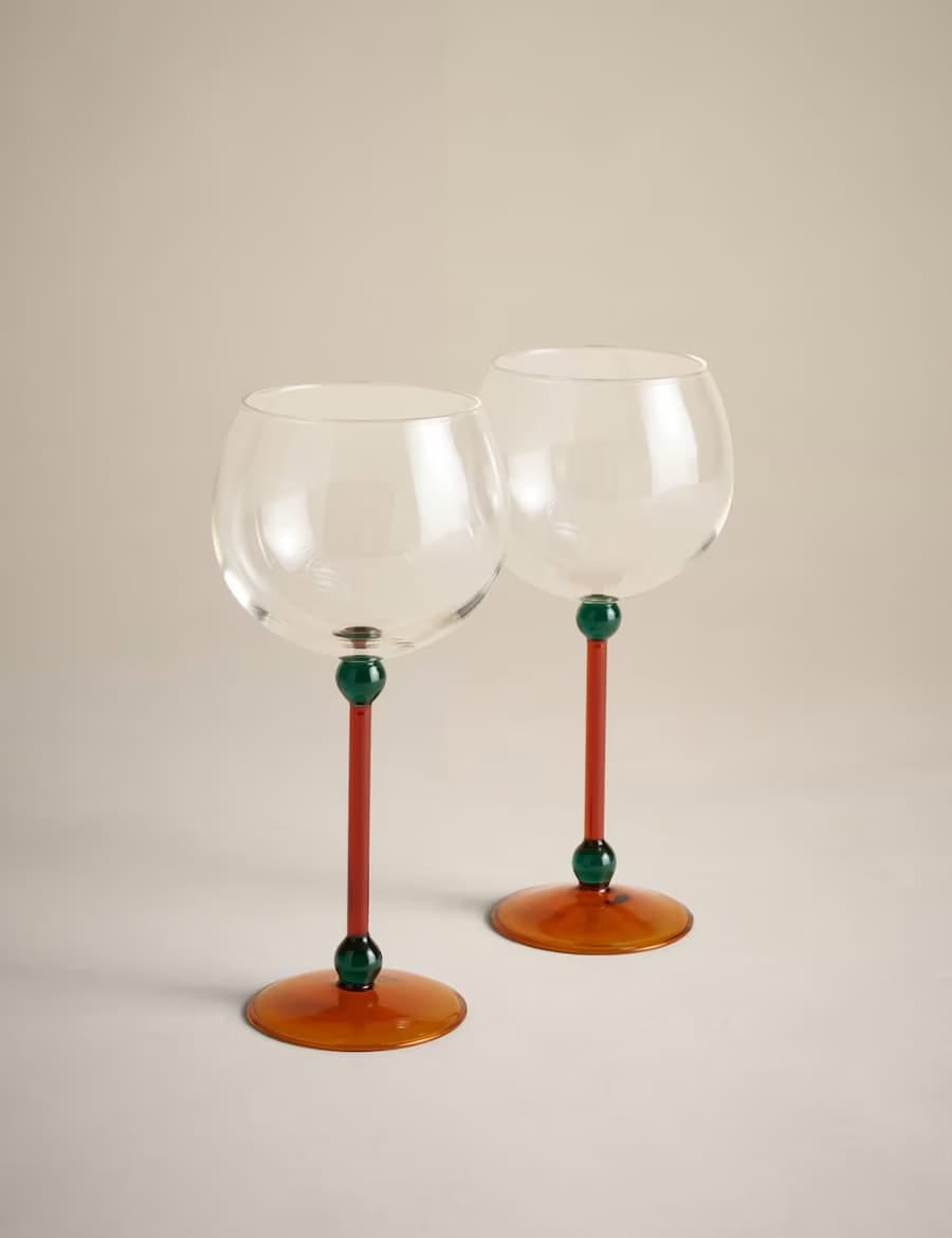 gin glasses with orange stem and green bobble